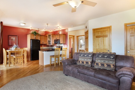 Open concept living, kitchen area.  Living room has a queen sleeper sofa. 