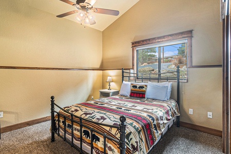 Timber Mountain Retreat Estes Park, Queen size bed in first lower level bedroom.