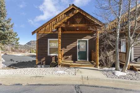 Front view of the townhouse style condo, single step up from parking lot to deck and condo entrance.