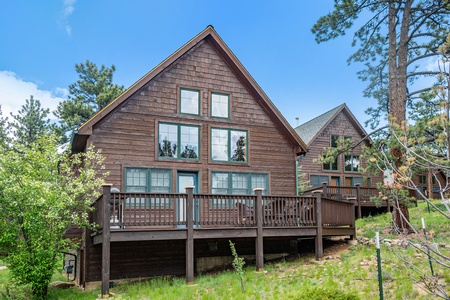 Exterior view of the cabin, with large deck.