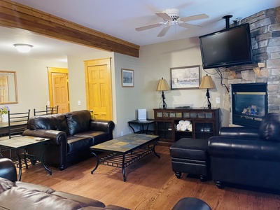 Open concept living room adjacent to kitchen.