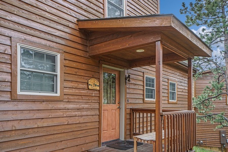 Exterior view of front door and small porch.