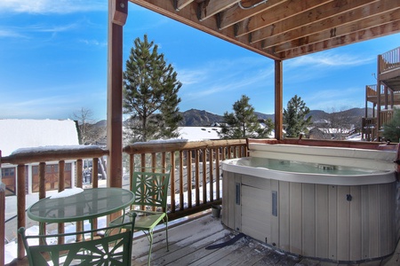 Private deck with its own hot tub and patio seating. Perfect place to relax and enjoy mountain views after a long day of adventures!