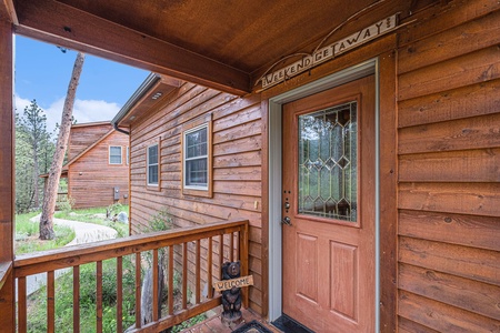 Exterior of front door with small porch.