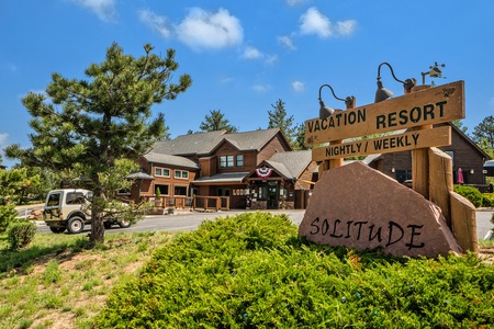 Solitude Cabins Lodge sign, and building front view.