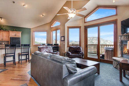 Floor to ceiling windows boast sweeping mountain views from the condo's main living area.