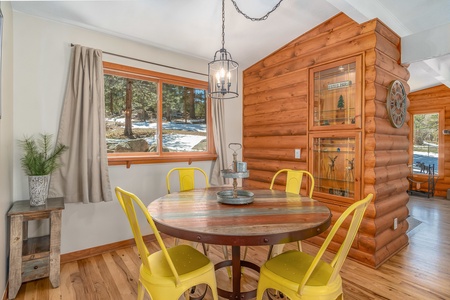 Lazy Elk Retreat Estes Park, Enjoy the views with each meal on this gorgeous dining table.