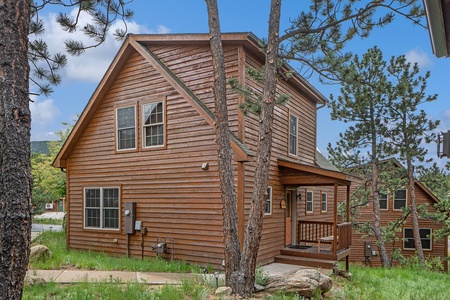 Exterior view with small porch and front door.