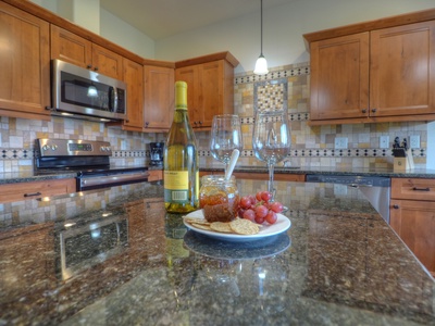 Gourmet kitchen with Mountain & Lake views.