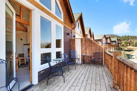 Upper (main) level deck with patio seating for four.