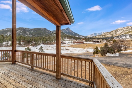 The spacious deck features a gas grill and beautiful mountain views