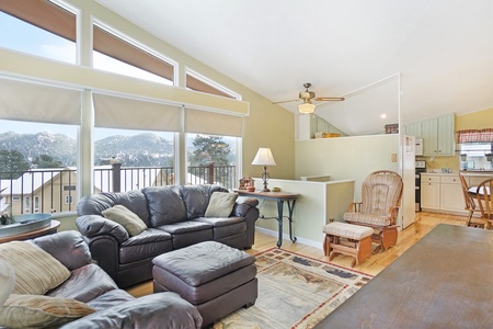 Living room with a couch, love seat, ottoman and rocking chair