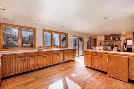 Open kitchen with a lot of counterspace opens into the room