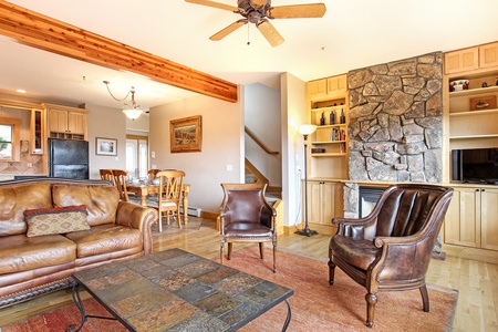 Beautiful stone, gas fireplace in the main living space. Comfortable sofa and recliner seating.