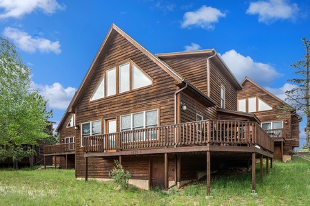 Exterior of cabin, with large deck.