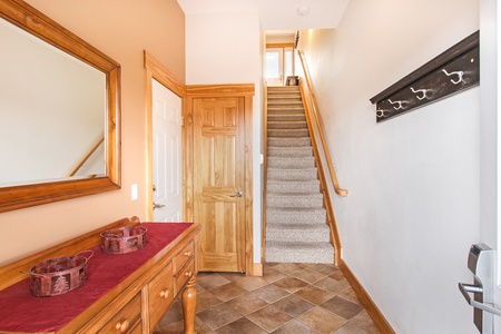 Stairs from garage level to the main level of this spacious condo. (You may also park one car at ground level and enter at the main floor)