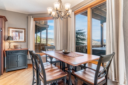 Dining area with seating for 6 and views out the large windows.