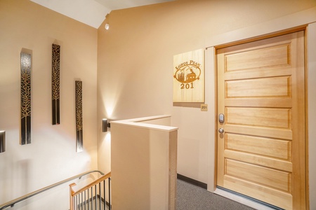 Front door to Longs Peak 201, on the second floor at top of stairs.