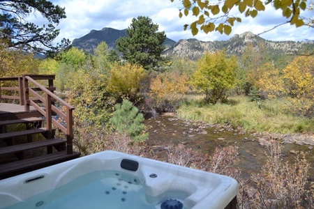 Enjoy the views of the river from your own private hot tub