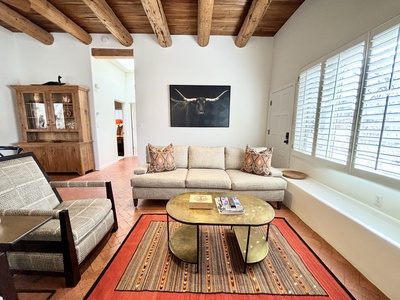 A living room with a couch and a coffee table.