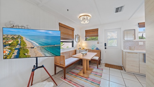 Step inside to a bright coastal entryway that sets the tone for a relaxing beach getaway. Stream your favorite shows and movies together on the large smart TV after a day at the beach.