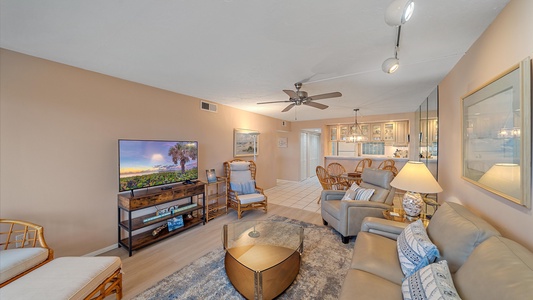 Plenty of seating in the living room with large Smart TV and perfect for family gatherings.