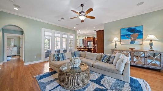 Spacious living area with plush sofa and plenty of seating with friends and family