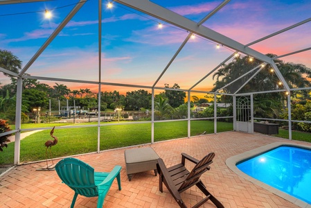 Backyard and screen-in lanai overlooks the canal, perfect for evening sunsets or morning coffee watching Florida wildlife and manatee viewing.
