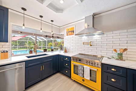 Large updated kitchen overlooking the pool area and perfect for the culinary enthusiast.