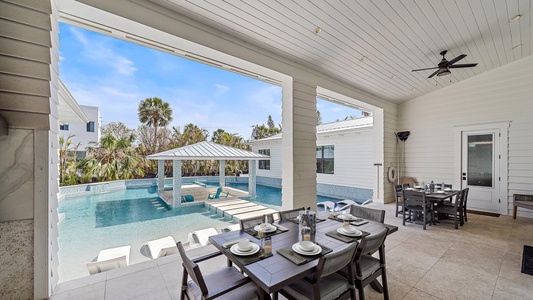 Outdoor seating area overlooks the pool, perfect for fun and socializing.