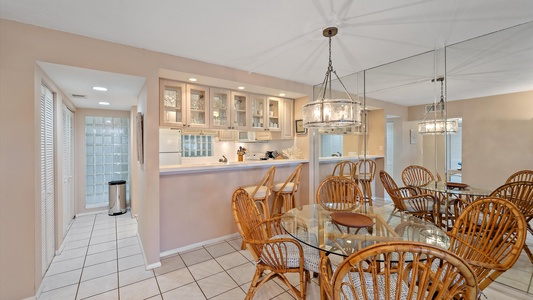 Dining room with plenty and additional seating at beautiful breakfast bar.