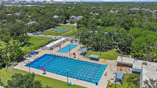 Just Steps to Arlington Park and Aquatic Center: Walk to this beloved local park offering lap and leisure pools, tennis and basketball courts, a modern fitness center, walking and biking trails, a shaded playground, BBQ grills, and picnic areas—ideal for