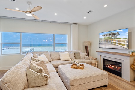 Breathtaking unobstructed views of the beach and sunset from the spacious updated living area. Large sofa perfect for gatherings with family and friends.