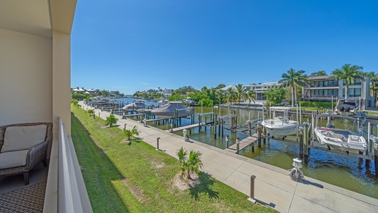Your private view overlooks the stunning canal waters and docks, offering a serene setting ideal for fishing and manatee watching in Sarasota.