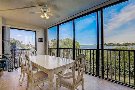 Sunroom  Sunroom  Sunroom with large dining table and views of the Sarasota Bay.