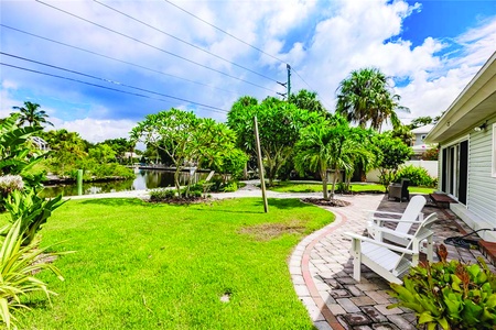 Backyard Area Backyard Area Private backyard with patio, outdoor furniture, view of canal.