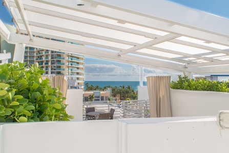 Partial ocean view while standing on the hot tub deck