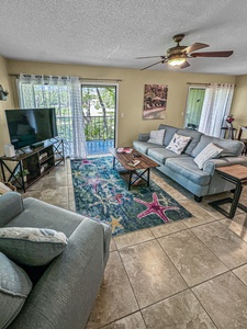 Living area with access to large patio