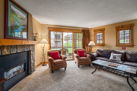 Fireplace, chairs, sliding glass door