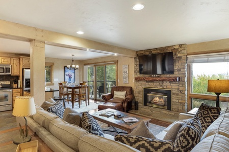 Photo taken from entryway showing living room, dining area, and kitchen.