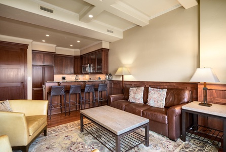 The open floor plan connects the living room, kitchen, and dining area.