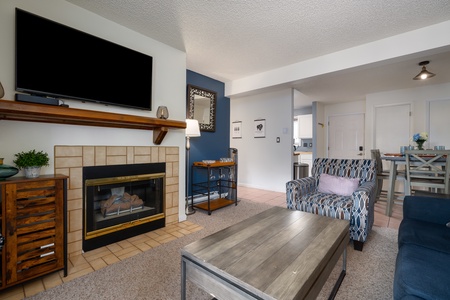 Photo taken from the far end of the living room showing the entryway