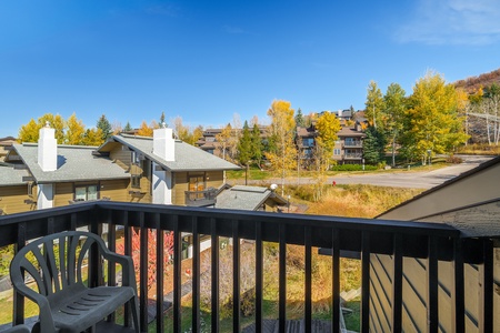 Through the sliding doors, you will find the patio that overlooks the lower Hillsider complex and mountain landscape.