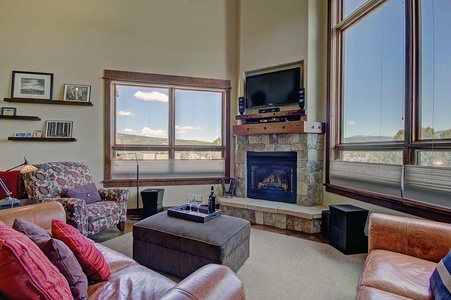 Open and spacious great room features gorgeous views, HDTV entertainment center & gas fireplace.