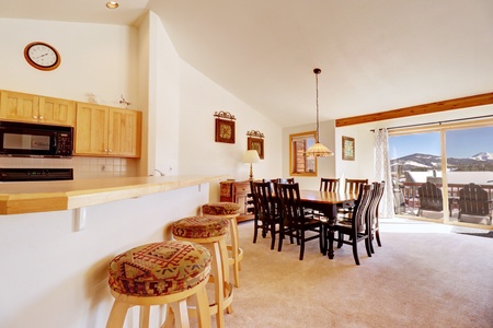 Open concept kitchen features barstool seating.