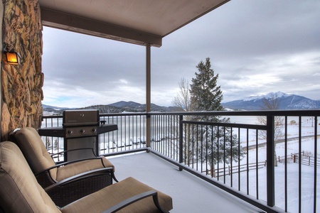 Private covered balcony with seating and grill. The balcony offers great views of Lake Dillon.