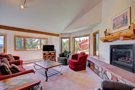 Open living room with gorgeous views Living area features gas fireplace.