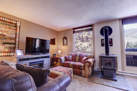 Beautiful living area with large window allowing ample natural light in