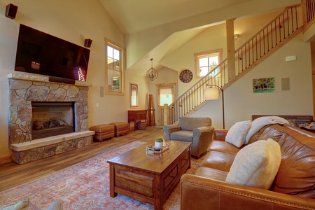 Cozy living room features a fireplace and TV