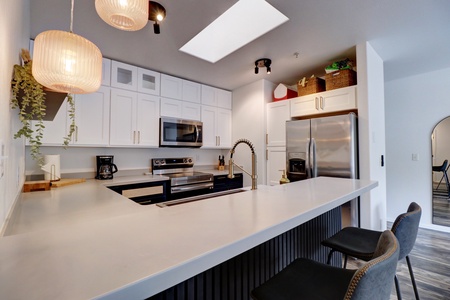 Modern kitchen with barstool seating area